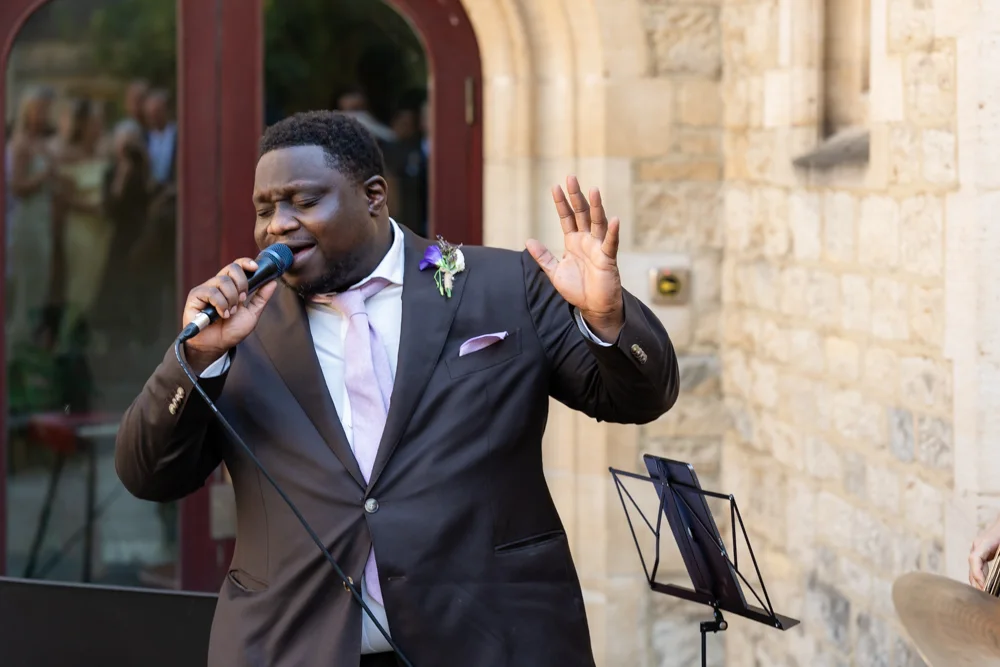 St Cross College wedding photographer. Singer performing for bride and groom