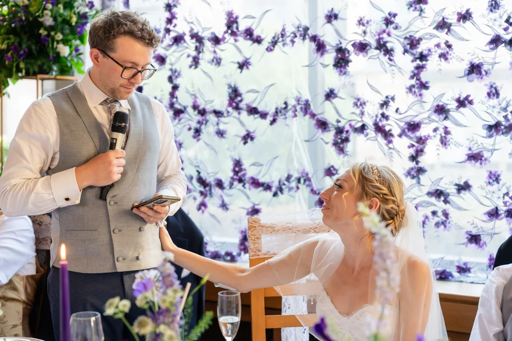 St Cross College wedding photographer. Bride comforting groom during his speech.
